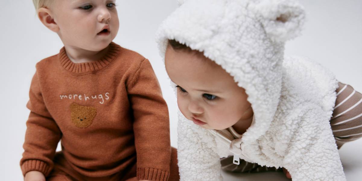 Babies wearing cosy clothing 